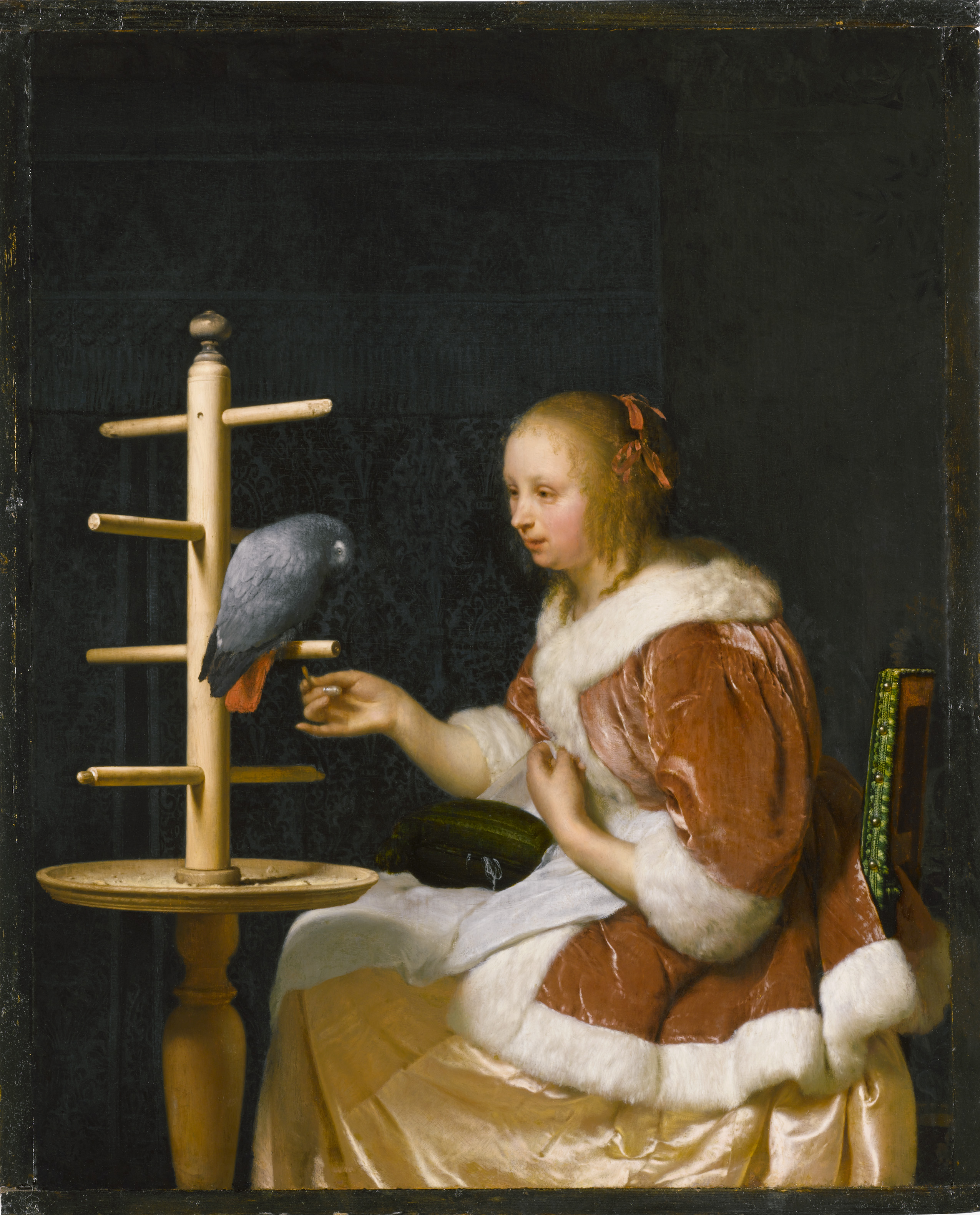 Young Woman Feeding a Parrot The Leiden Collection